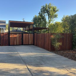 Completed fence, gate and custom carport for our camper. Completed fence, gate and custom carport for our camper.