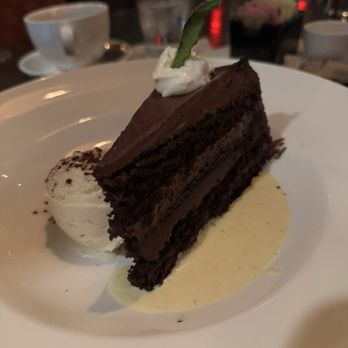 Cooper’s Hawk Winery & Restaurant - Cooper chocolate cake with vanilla ice cream and vanilla bean sauce - Wine Bars Near Me - Algonquin, Illinois Cooper’s Hawk Winery & Restaurant - Cooper chocolate cake with vanilla ice cream and vanilla bean sauce - Wine Bars Near Me - Algonquin, Illinois