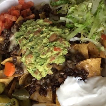 Sergio's Taqueria & Pizza - Nachos Supreme with Carne Asada, beans on the side - Mexican Near Me - Chicago, Illinois Sergio's Taqueria & Pizza - Nachos Supreme with Carne Asada, beans on the side - Mexican Near Me - Chicago, Illinois