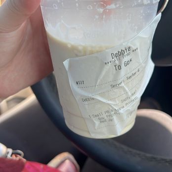 Jamba - a hand holding a plastic cup with a drink in it - Juice Bars & Smoothies Near Me - Tracy, California