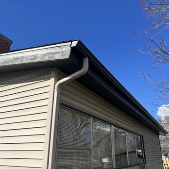 ProFlow Gutter Solutions - Installed gutters with downspout - Gutter Services Near Me