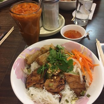 Saigon 2 - Rice stick noodle with grilled slice pork Rice with Grilled Pork Chop and Egg Rolls . Thai ice tea - Vietnamese Near Me - Rio Rancho, New Mexico
