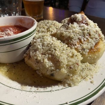 Pizza Bruno - These garlic knots are AMAZING! Garlic Knots with Sauce - Pizza Near Me - Orlando, Florida Pizza Bruno - These garlic knots are AMAZING! Garlic Knots with Sauce - Pizza Near Me - Orlando, Florida