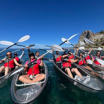 Tahoe Paddle Sports - Group photo on the Lake with Cave Rock behind us! credit: Alex, our guide. - Rafting/Kayaking Near Me Tahoe Paddle Sports - Group photo on the Lake with Cave Rock behind us! credit: Alex, our guide. - Rafting/Kayaking Near Me