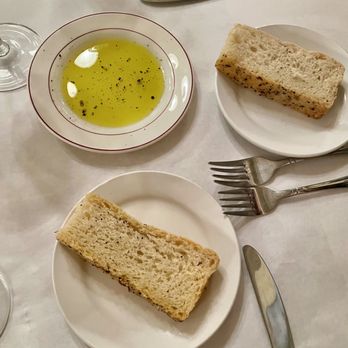 Santé - two plates of bread and a bowl of olive oil - New American Near Me - Matthews, North Carolina