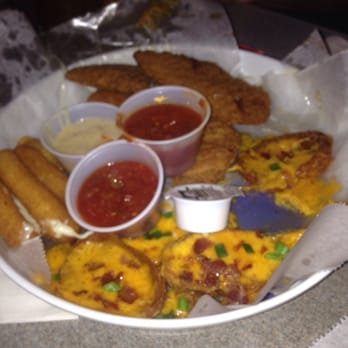 Holties Restaurant & Pub - Part of the sampler platter. Jalapeño poppers, mozzarella sticks, chicken tenders and potato skins. - American Near Me - Barnhart, Missouri