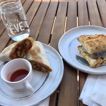 Reve Coffee Lab - Southwest breakfast burrito (left), sausage biscuit (right) - Coffee & Tea Near Me - Baton Rouge, Louisiana