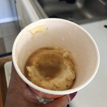 Popeyes - a hand holding a cup of mashed potatoes - Fast Food Near Me - Lovejoy, Georgia Popeyes - a hand holding a cup of mashed potatoes - Fast Food Near Me - Lovejoy, Georgia
