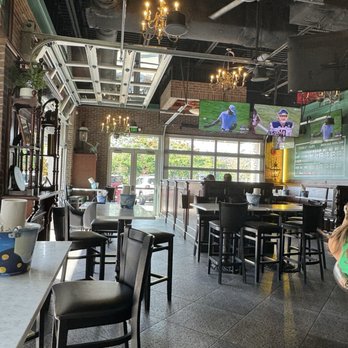 Shea's Lansdowne Streets - View from indoor/potiential outdoor space. Garage doors allow for open air in nice days that connect to the welcoming patio #bluemoon #pub - Sports Bars Near Me - Naples, Florida Shea's Lansdowne Streets - View from indoor/potiential outdoor space. Garage doors allow for open air in nice days that connect to the welcoming patio #bluemoon #pub - Sports Bars Near Me - Naples, Florida