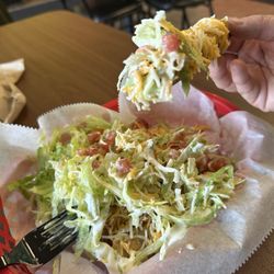 America's Taco Shop - Shredded beef taquitos topped with lettuce, cheese, sour cream, and avocado sauce with a side of pico de gallo.   Yum!
