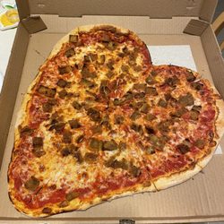 Heart shaped eggplant topping pizza