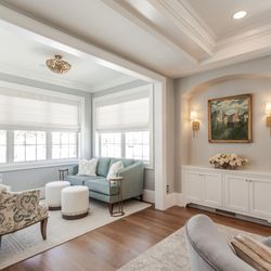 This whole-home renovation blends traditional character, custom cabinetry, tailored furnishings, and modern comfort for family gatherings.