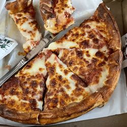 The Grandstand Sports Bar & Grill - Pizza. You can see the grease