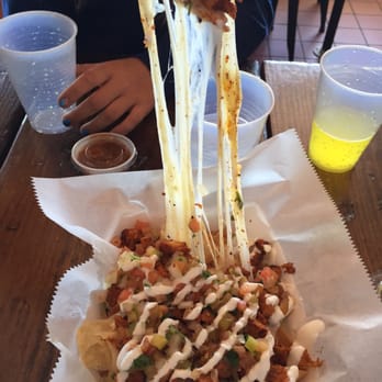 ASADA - Chicken nachos!- very cheesy! - Latin American Near Me - Greenville, South Carolina ASADA - Chicken nachos!- very cheesy! - Latin American Near Me - Greenville, South Carolina