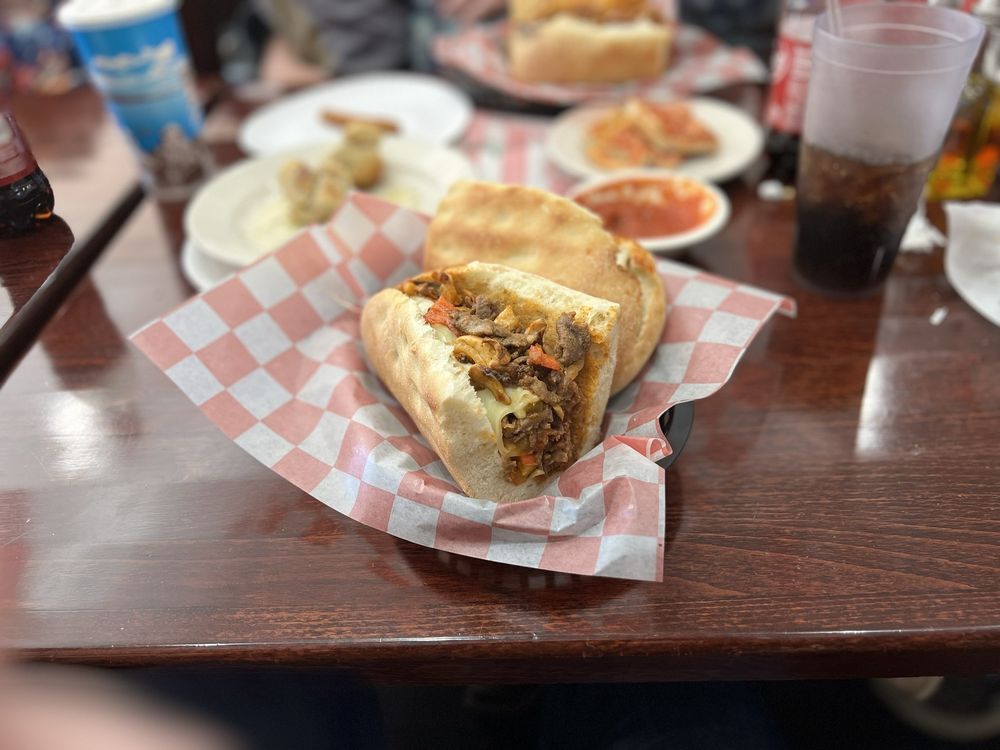 Amigos Pizzeria & Mexican Restaurant Logo