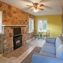 The Hideout - Vacation Rental Apartment - Cozy living area with relaxing amenities.