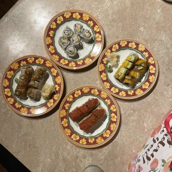 Wasabi Daniel Island - four plates of food on a table - Japanese Near Me - Charleston, South Carolina Wasabi Daniel Island - four plates of food on a table - Japanese Near Me - Charleston, South Carolina