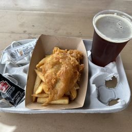 Beer-battered fish and chips ($13.49) and bombardier amber ale ($11.25)