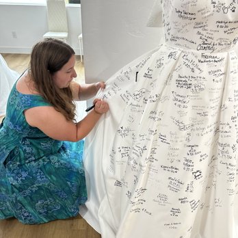 Weddings With Joy - Signing a dress in the boutique. - Bridal Near Me - Lacey, Washington Weddings With Joy - Signing a dress in the boutique. - Bridal Near Me - Lacey, Washington
