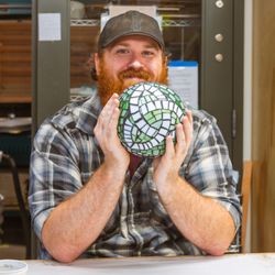 Henderson Arts - That's the look of someone who just made their first mosaic. Gazing ball class with Henderson Arts -- beginners always welcome.