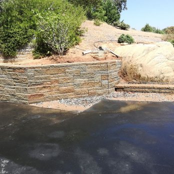 MountainSide Landscaping - A retaining wall we took apart and reinstalled further back to provide space for the home owner to move their RV in and out of the garage. - Landscaping Near Me