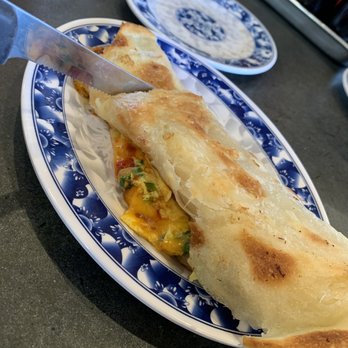 Joy - Thousand Layer Pancake with Egg and Cheese and chili oil + basil - Taiwanese Near Me - Los Angeles, California Joy - Thousand Layer Pancake with Egg and Cheese and chili oil + basil - Taiwanese Near Me - Los Angeles, California