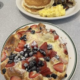 Blueberry and strawberry soufflé pancake and buttermilk combo Blueberry and strawberry soufflé pancake and buttermilk combo