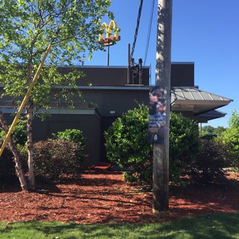 McDonald's - a sign on a pole in front of a restaurant - Fast Food Near Me - Opelika, Alabama