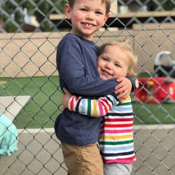 Scottsdale Childcare and Learning Center - Brother and sister getting to say hi on on the playground! :)