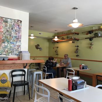 Kris Fish and Chips - two people sitting at a table - Seafood Near Me - Gimli, Manitoba