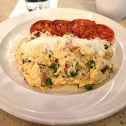 Ellen's Bakery & Cafe - Zucchini Carbornara Scrambled Eggs with bacon, tomato, peas and Parmesan Cheese with tomatoes, English Muffin & Orange Marmalade Butter.