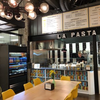 La Pasta - a long table with yellow chairs - Italian Near Me - Victoria, British Columbia