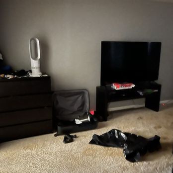 inNout Movers - 70 inch TV in bedroom along with chest of drawers and dresser - Movers Near Me - Round Rock, Texas