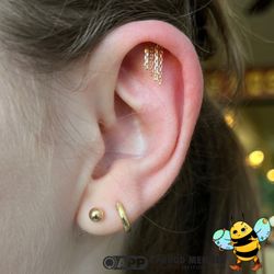Honeycomb Jewelry and Piercing - Hidden helix piercing