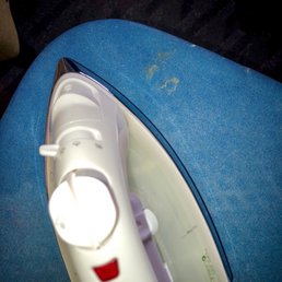 Food or rust on ironing board. Not great for ironing white dress shirts as I was.