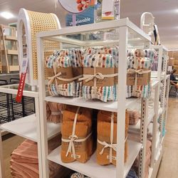 HomeGoods - Sand Cloud towel sets.