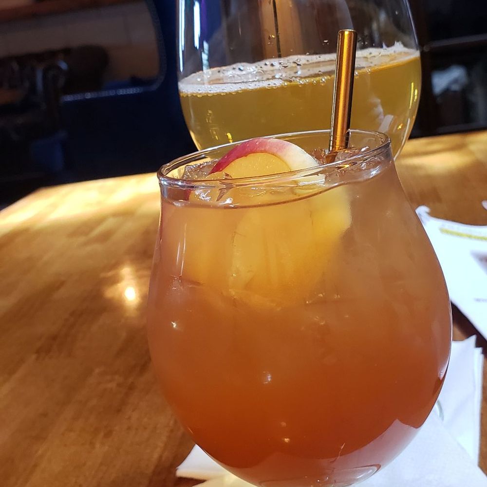 A Roll in the Hay Cider and Peach Heimat cocktail and Orchard Hill Bitters and Sharps Cider. A Roll in the Hay Cider and Peach Heimat cocktail and Orchard Hill Bitters and Sharps Cider.