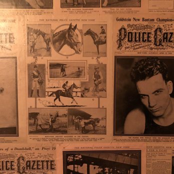 The Bookcase and Barber - The best bathroom wallpaper - Barbers Near Me - Durango, Colorado