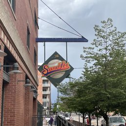 a brick building with a sign that says sandlot