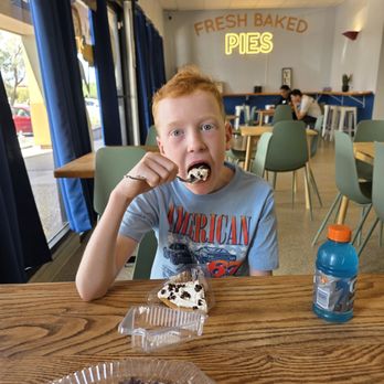 Sydney’s Sweet Shoppe - Enjoying his chocolate pudding pie - Desserts Near Me - Tucson, Arizona Sydney’s Sweet Shoppe - Enjoying his chocolate pudding pie - Desserts Near Me - Tucson, Arizona
