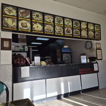 Uncle Wen's China Express - The counter, Which looks like every counter in every Chinese carry out place. - Chinese Near Me - Sarasota, Florida Uncle Wen's China Express - The counter, Which looks like every counter in every Chinese carry out place. - Chinese Near Me - Sarasota, Florida