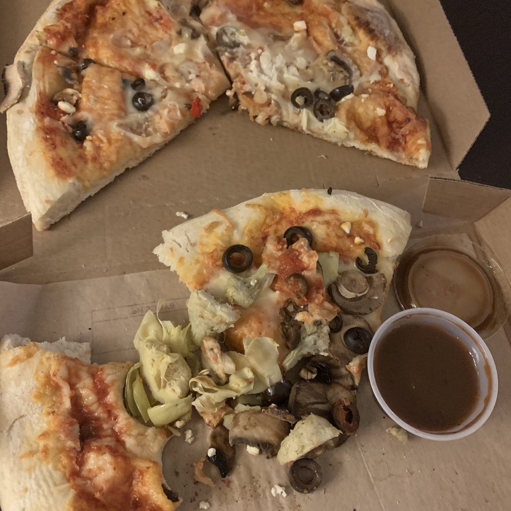 MOD Pizza - a half eaten pizza and a cup of sauce - Fast Food Near Me - Walla Walla, Washington MOD Pizza - a half eaten pizza and a cup of sauce - Fast Food Near Me - Walla Walla, Washington