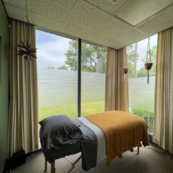 Lyndy, Reiki Master - With natural lighting from the floor-to-ceiling windows, you are sure to feel relaxed during your Reiki session.