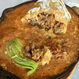 The inside of the Chapman Burrito. It's fully loaded with so much goodness. Carne asada and chorizo is such a good mix.