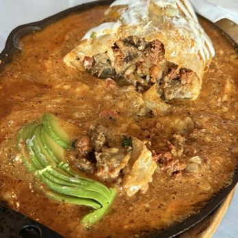 Super Antojitos - The inside of the Chapman Burrito. It's fully loaded with so much goodness. Carne asada and chorizo is such a good mix. - Mexican Near Me - Orange, California