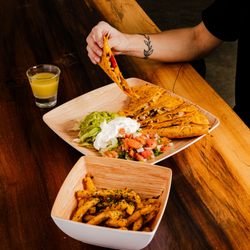 Juice Almighty - Chicken quesadilla with a side of garlic fries.