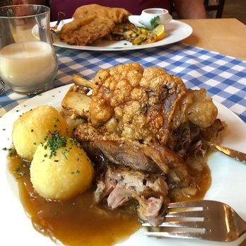Zollpackhof - Crispy pig knuckle with potato dumplings; veal schnitzel in background. - German Near Me - Berlin, BE