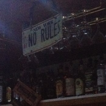 The Checkmate Inn - a no rules sign hanging from the ceiling - Beer Bar Near Me - Setauket, New York