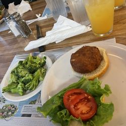 Tony & George's Seafood & Italian Restaurant - Crabcake sandwich with a side of broccoli
