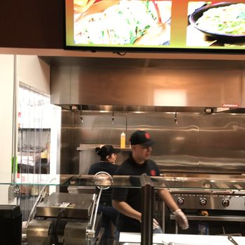 California Burritos - a man and a woman preparing food - Tacos Near Me - Nashua, New Hampshire California Burritos - a man and a woman preparing food - Tacos Near Me - Nashua, New Hampshire